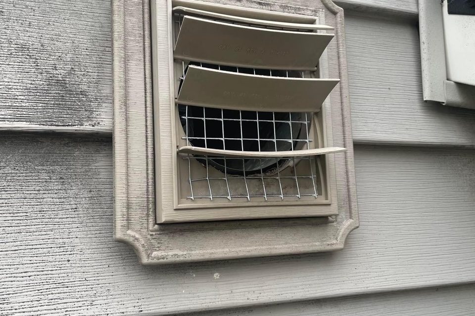 Screened vent cover installed to keep wildlife out of a home